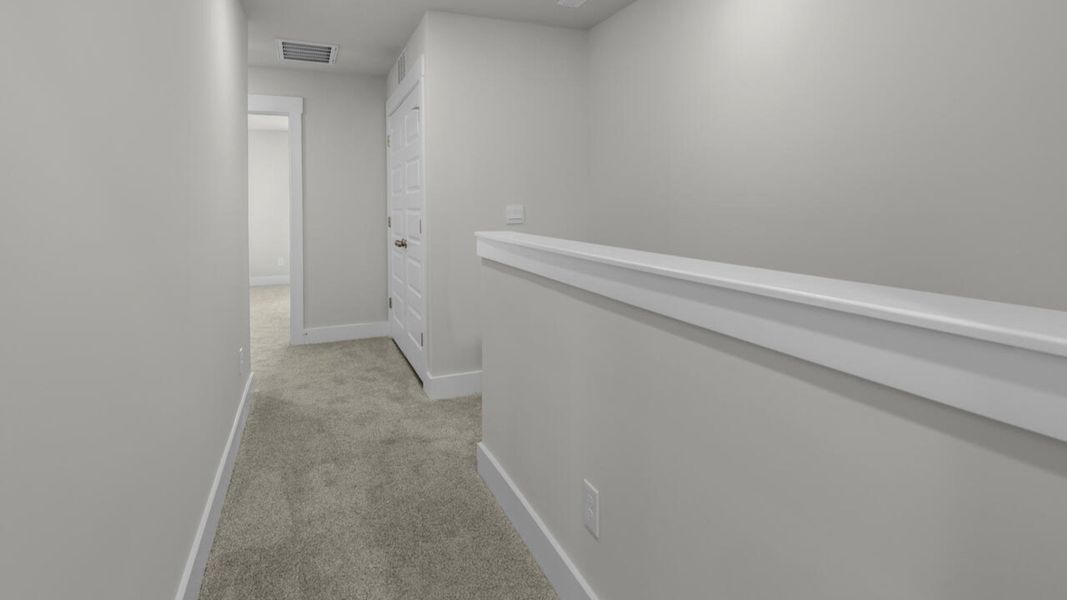 Representative unfurnished interior of a home built from the CARDINAL by D.R. Horton in Indigo Preserve Townhomes, Leland (Image 18).