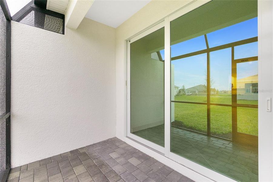 Exterior details and patio area of a home in Island Lakes at Coco Bay: Villas, Englewood (Image 2).