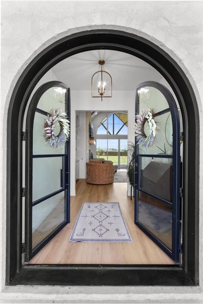 Stunning arched double door entry. Stunning arched double door entry.