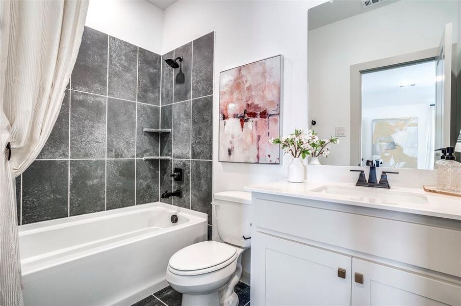 Friends and family will feel right at home in any of the beautifully finished guest baths in our Sinclaire plan.