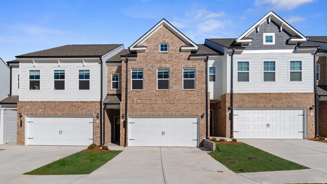 New construction townhome with brick front and two car garage in Riverdale, GA. New construction townhome with brick front and two car garage in Riverdale, GA.