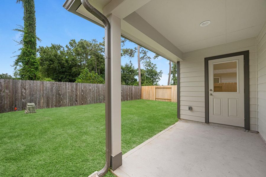Exterior details and patio area of a home in Cypresswood Landing, Humble (Image 3).