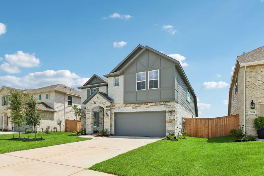 Front exterior of a new home in Kingdom Heights, Rosenberg, TX, highlighting curb appeal (Image 2). Front exterior of a new home in Kingdom Heights, Rosenberg, TX, highlighting curb appeal (Image 2).