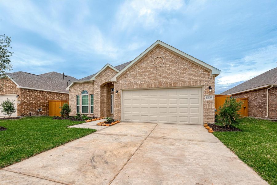 Front exterior of a new home in Cypress Green, Hockley, TX, highlighting curb appeal (Image 27).