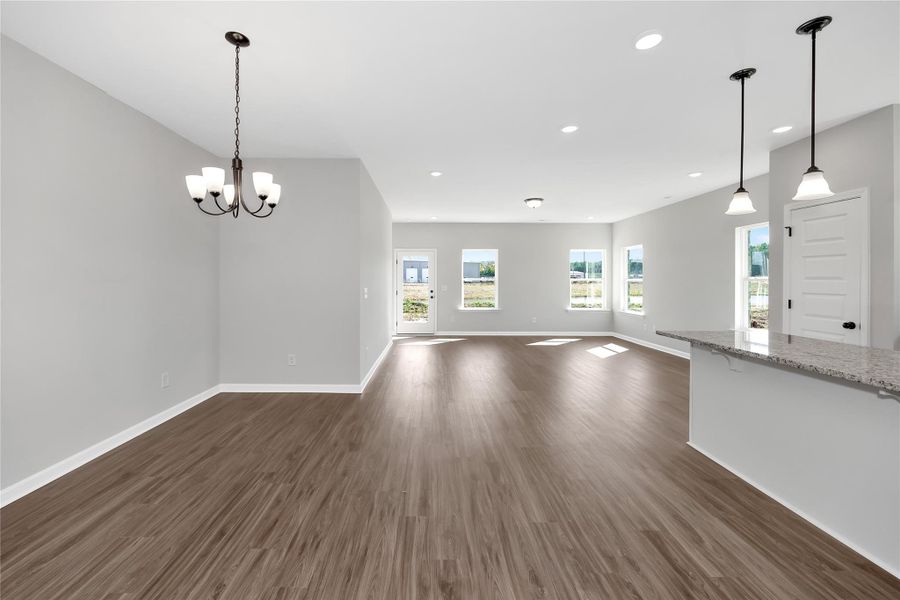 The Pearson- Dining Area into Family Room. Home under construction. Sample floor plan photo used for illustrative purposes only. Upgrades, selections options, and colors will vary. The Pearson- Dining Area into Family Room. Home under construction. Sample floor plan photo used for illustrative purposes only. Upgrades, selections options, and colors will vary.