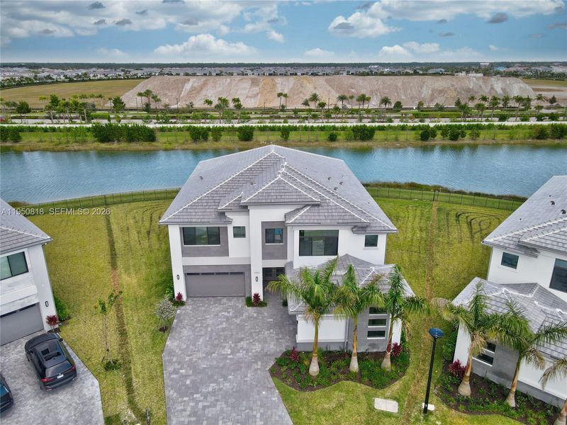 Front exterior of a new home in , Palm Beach Gardens, FL, highlighting curb appeal (Image 26). Front exterior of a new home in , Palm Beach Gardens, FL, highlighting curb appeal (Image 26).