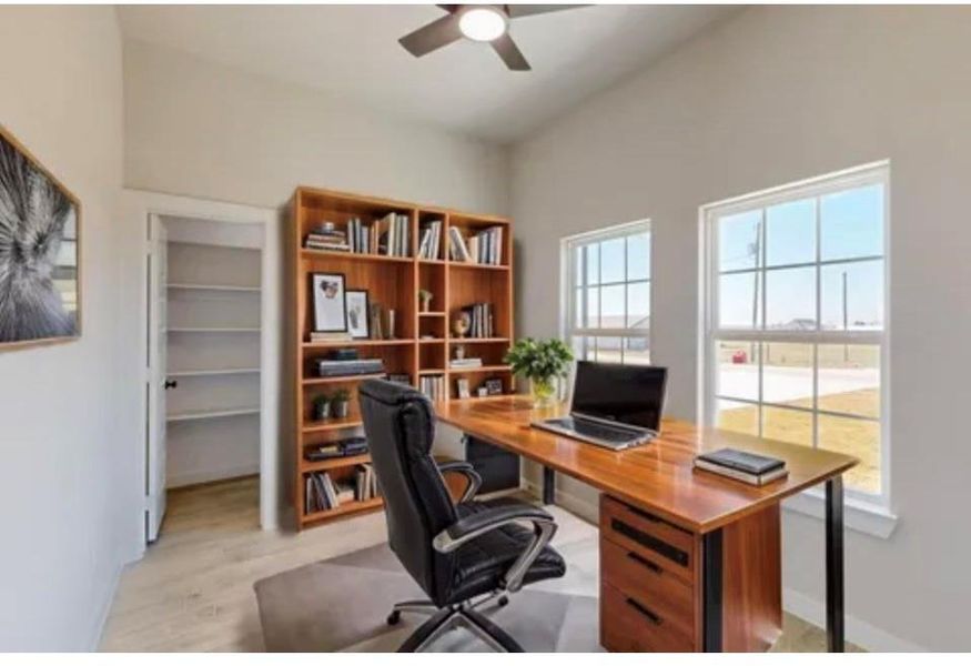 Office area featuring a ceiling fan and light wood-style floors Office area featuring a ceiling fan and light wood-style floors