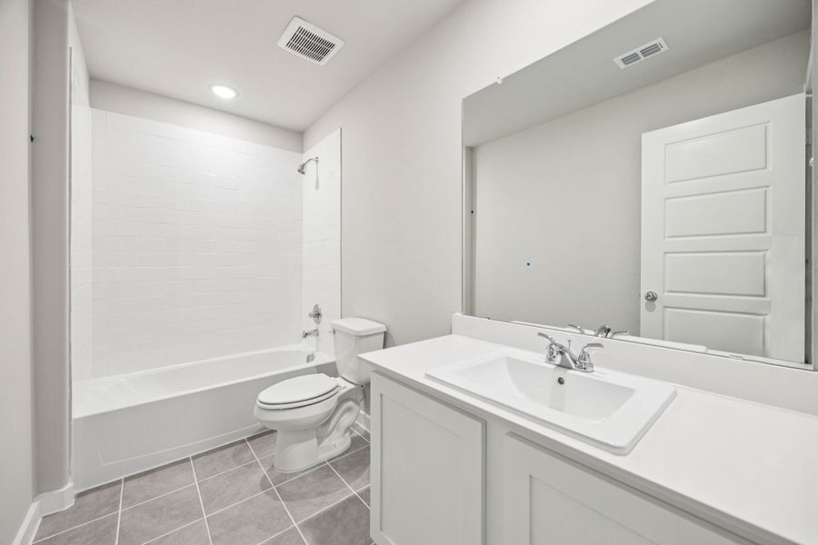 Bathroom in the Hayden home plan by Trophy Signature Homes – REPRESENTATIVE PHOTO