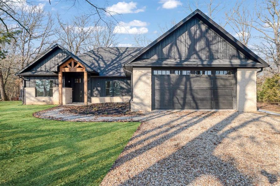 Front exterior of a new home in , Powderly, TX, highlighting curb appeal (Image 1). Front exterior of a new home in , Powderly, TX, highlighting curb appeal (Image 1).