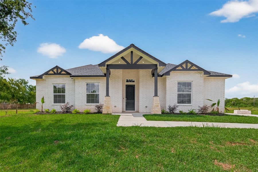 Front exterior of a new home in , Hitchcock, TX, highlighting curb appeal (Image 2).