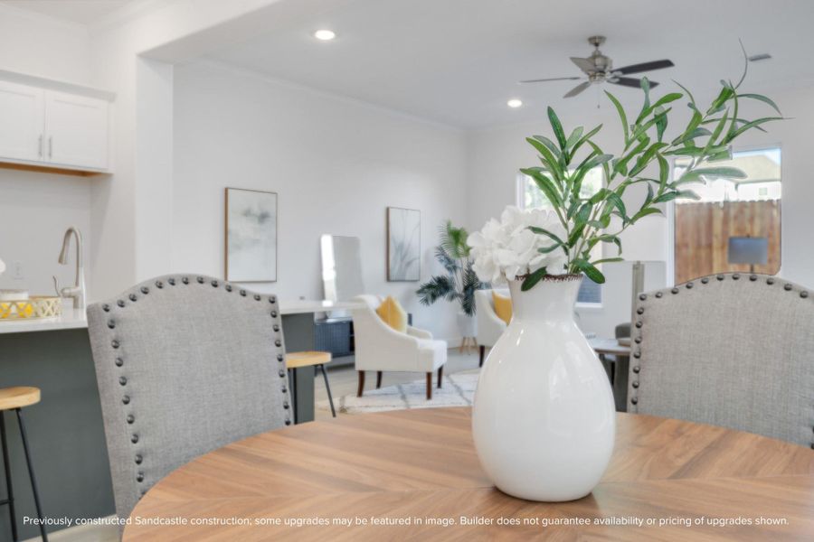 Oversized windows line the back wall, filling your home with natural light and offering a welcoming view to the private, fenced backyard.