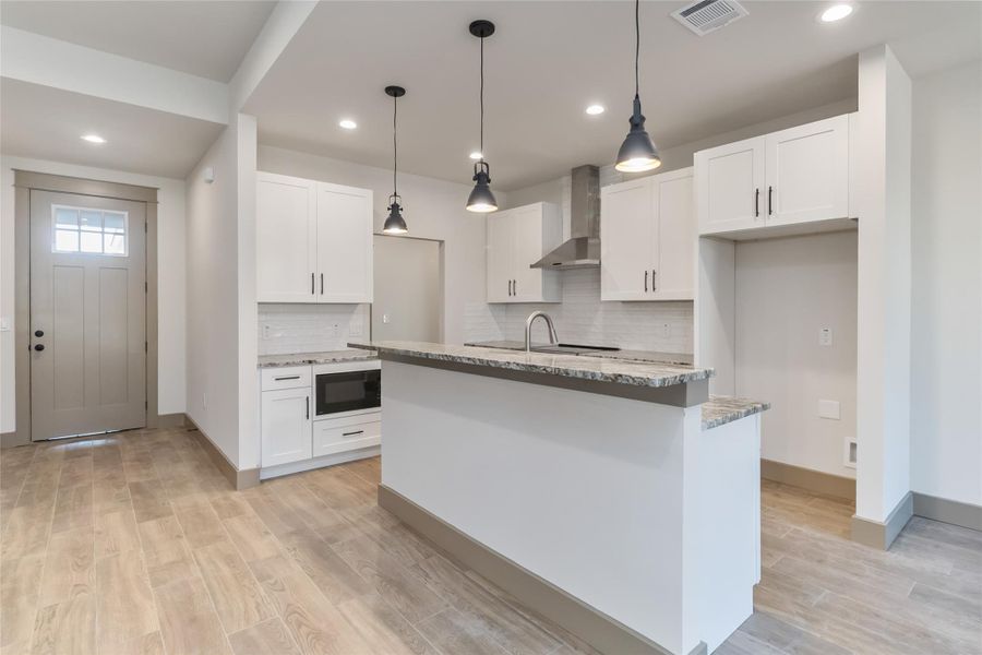 Kitchen with view of front door