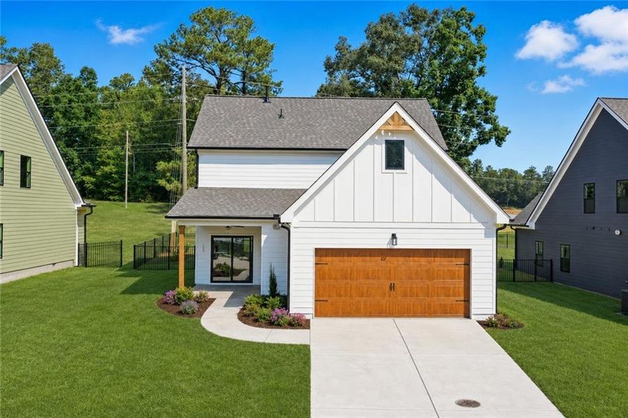 Front exterior of a new home in , Emerson, GA, highlighting curb appeal (Image 24).