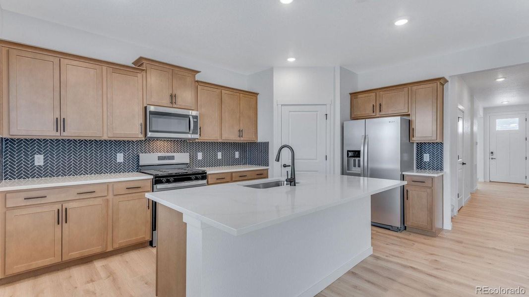 Furnished interior view inside a new home in Trails at Crowfoot, Parker (Image 8).