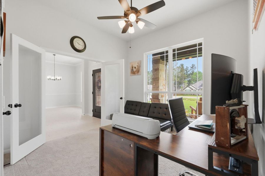 A flexible space just off the entry, perfect for a home office, with the option to easily serve as a fourth bedroom when needed.