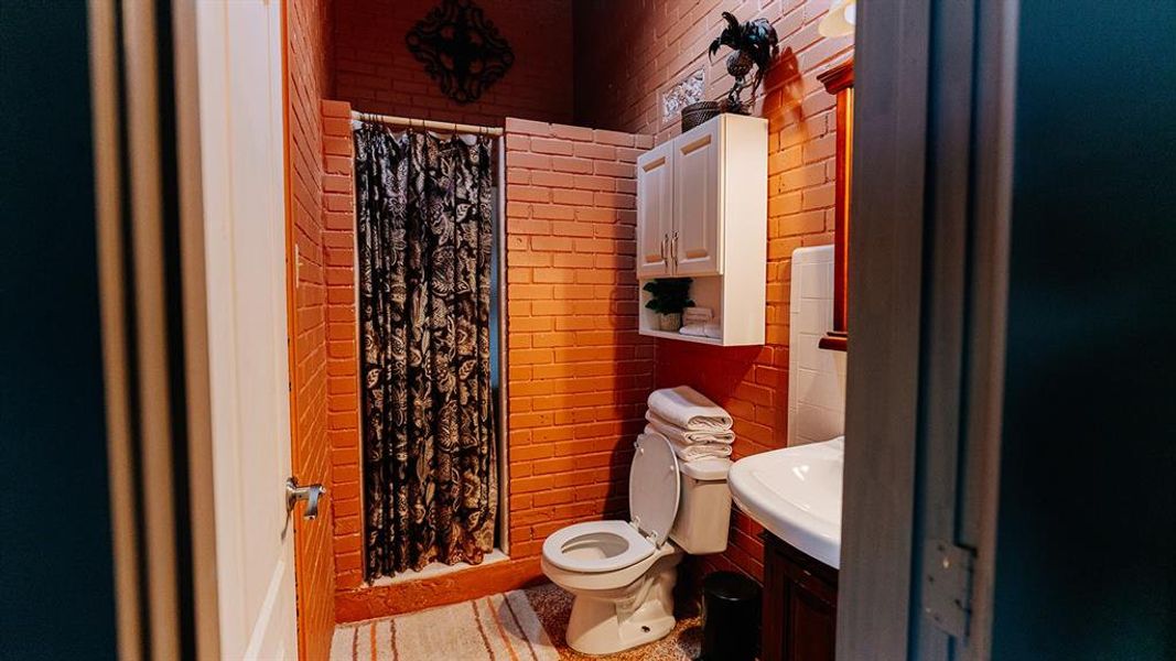 Bathroom featuring a stall shower and vanity