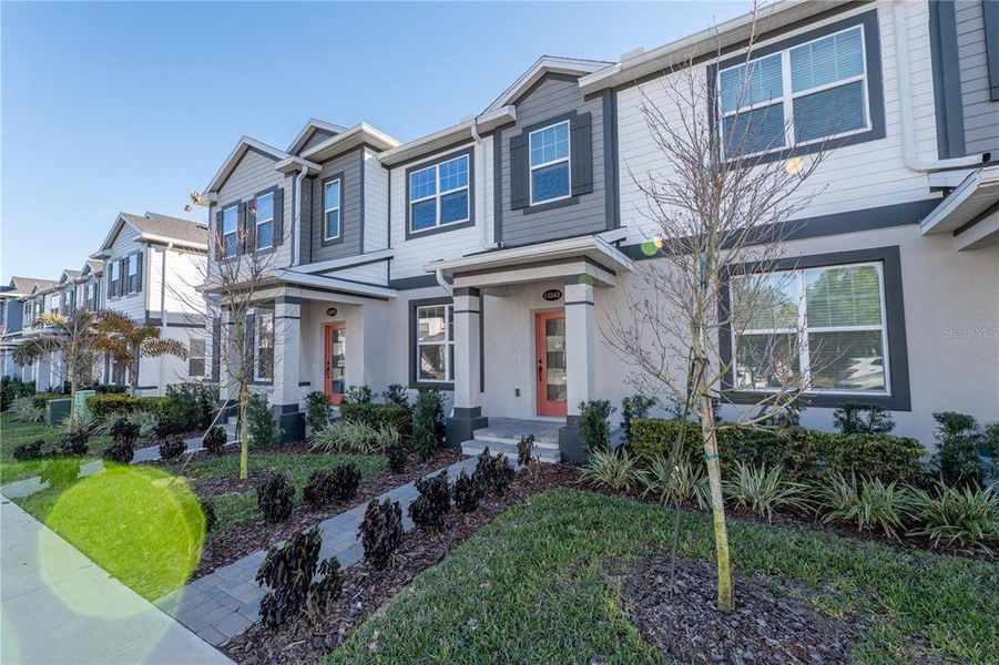 Front exterior of a new home in , Winter Garden, FL, highlighting curb appeal (Image 23). Front exterior of a new home in , Winter Garden, FL, highlighting curb appeal (Image 23).