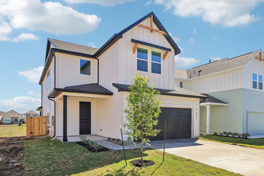 Front exterior of a new home in Lariat, Liberty Hill, TX, highlighting curb appeal (Image 21). Front exterior of a new home in Lariat, Liberty Hill, TX, highlighting curb appeal (Image 21).