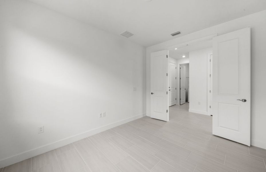 Enclosed flex room featuring French doors