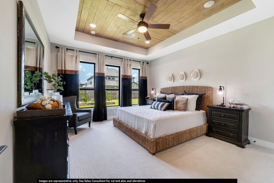 Carpeted bedroom featuring wood ceiling, a raised ceiling, recessed lighting, and ceiling fan Carpeted bedroom featuring wood ceiling, a raised ceiling, recessed lighting, and ceiling fan