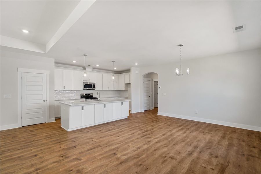 Open Concept - Photo is of actual home for sale.