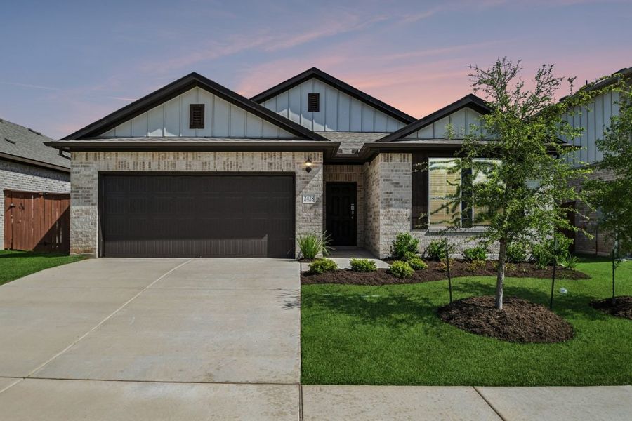 Front exterior of a new home in Oaks at San Gabriel, Georgetown, TX, highlighting curb appeal (Image 1). Front exterior of a new home in Oaks at San Gabriel, Georgetown, TX, highlighting curb appeal (Image 1).