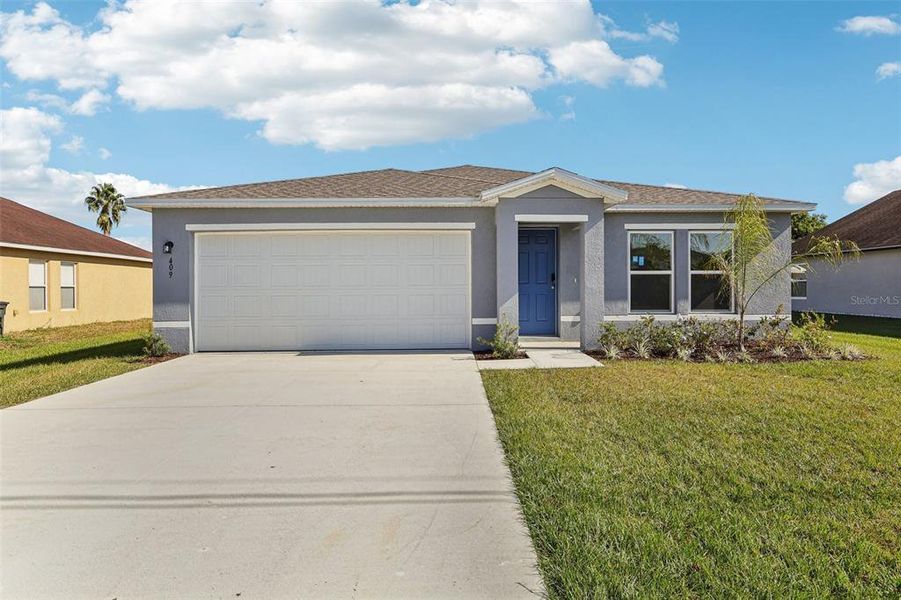Front exterior of a new home in Stone Ridge, Sebring, FL, highlighting curb appeal (Image 9).