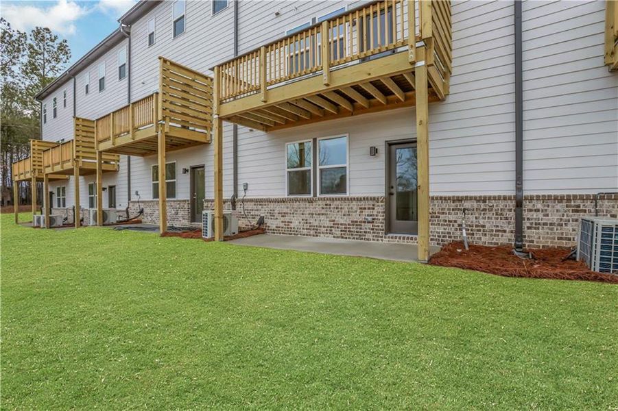 Exterior details and patio area of a home in Towne Village at Suwanee Dam, Sugar Hill (Image 26). Exterior details and patio area of a home in Towne Village at Suwanee Dam, Sugar Hill (Image 26).