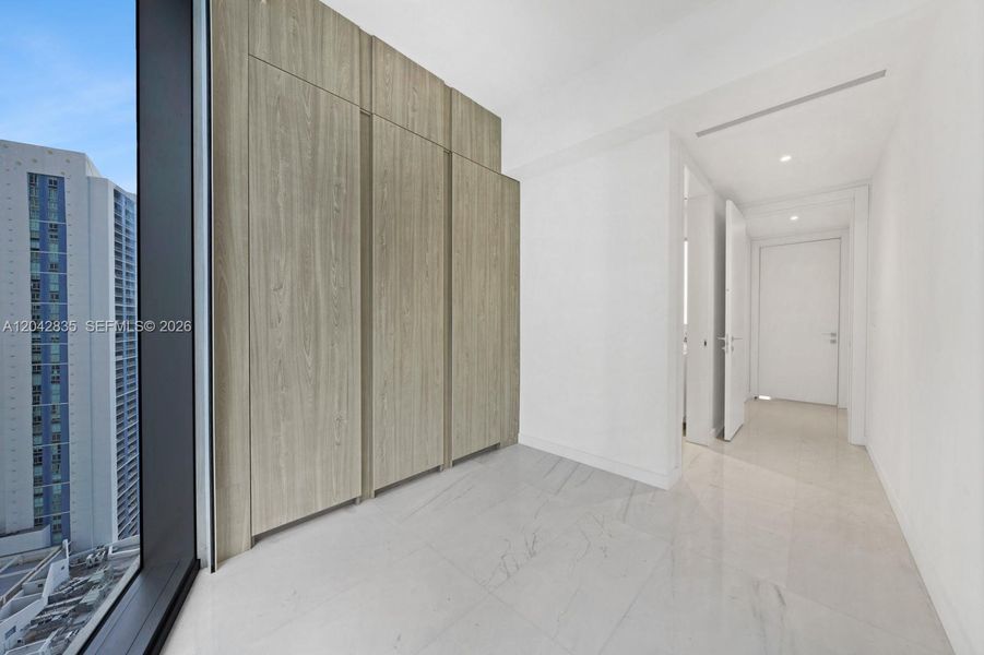 Spacious, unfurnished interior of a new home in Aston Martin Residences, Miami (Image 26).