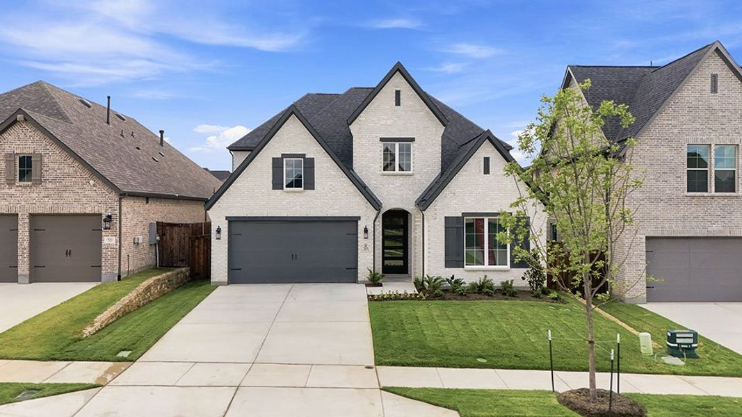 Front exterior of a new home in Tavolo Park, Fort Worth, TX, highlighting curb appeal (Image 25).