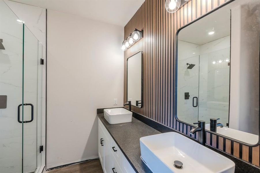 Master Bathroom with vanity, walk in shower, and hardwood / wood-style flooring