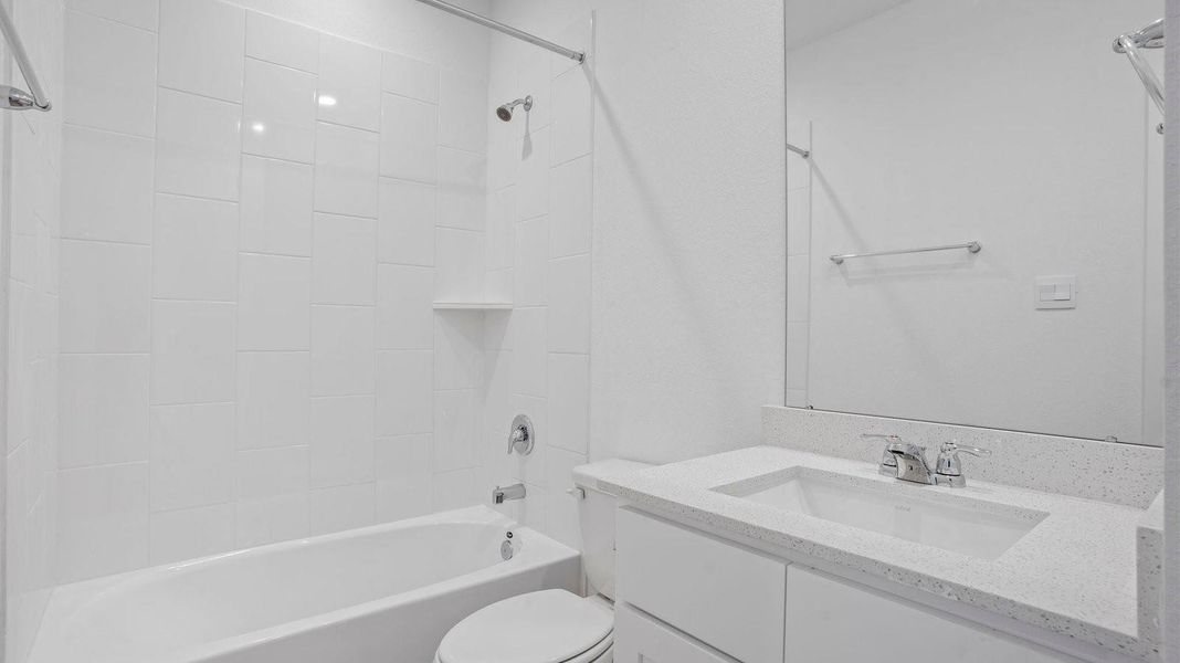 Furnished interior view inside a new home in Caldwell Crossing, Iowa Colony (Image 7).