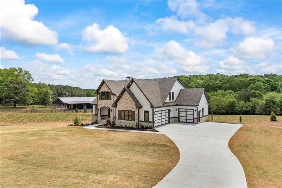 Front exterior of a new home in , Monroe, GA, highlighting curb appeal (Image 30). Front exterior of a new home in , Monroe, GA, highlighting curb appeal (Image 30).