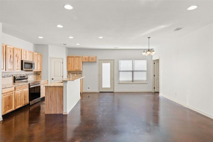 View of kitchen and dining area from living room