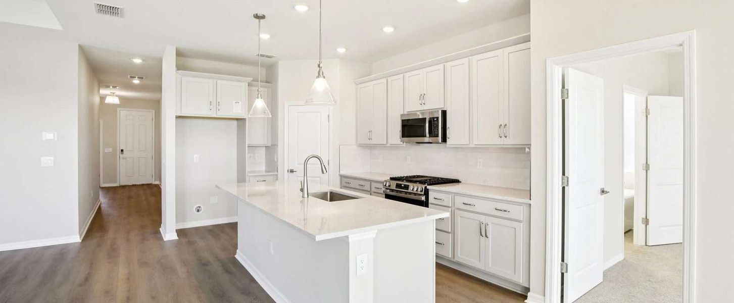 Kitchen with a large island - Representative images and renderings are for illustrative purposes this home will feature our standard collection Kitchen with a large island - Representative images and renderings are for illustrative purposes this home will feature our standard collection