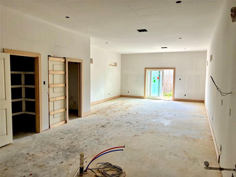 1st floor living space. Sliding doors leading to the back covered patio and backyard.