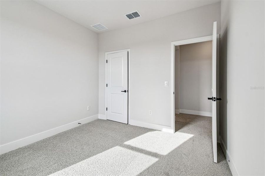 Spacious, unfurnished interior of a new home in Waterset Tradition Series, Apollo Beach (Image 32).