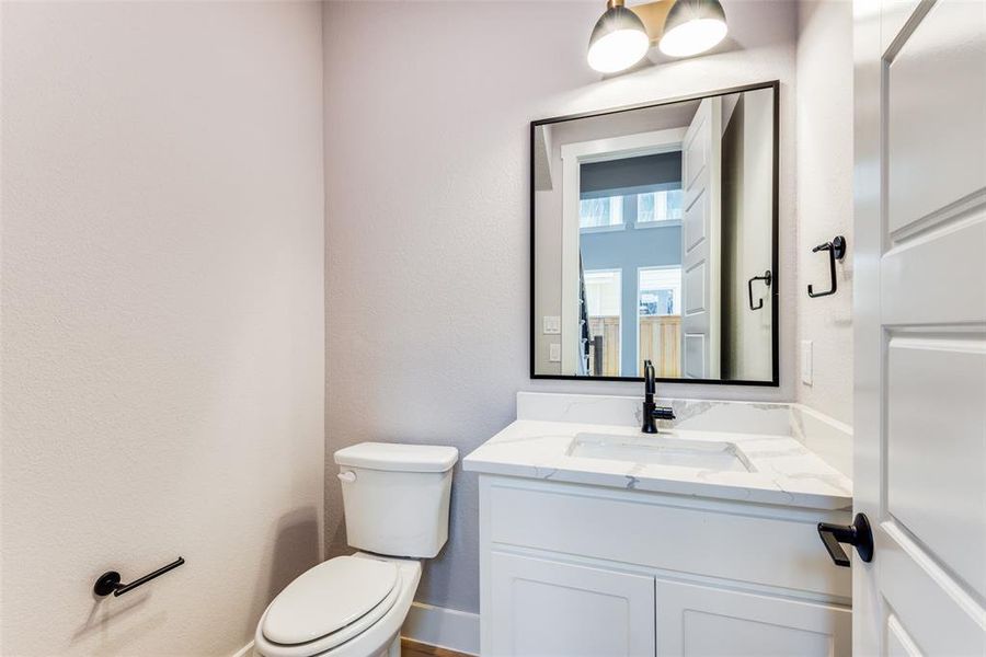 Bathroom with vanity and toilet