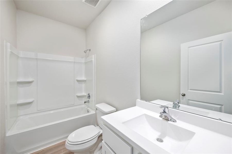 The secondary bathroom is conveniently located centrally in the home.