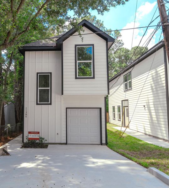 Front exterior of a new home in , Willis, TX, highlighting curb appeal (Image 23).