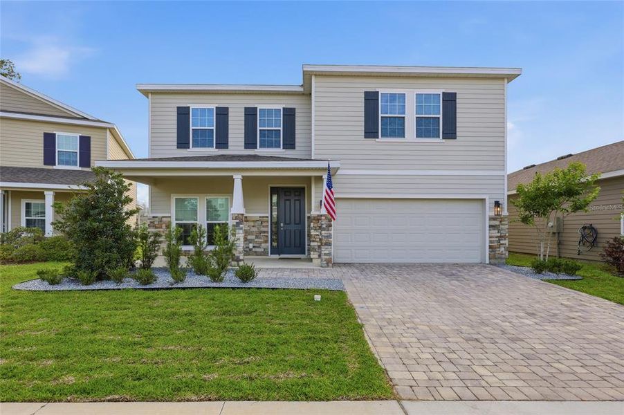 Front exterior of a new home in , Newberry, FL, highlighting curb appeal (Image 21).