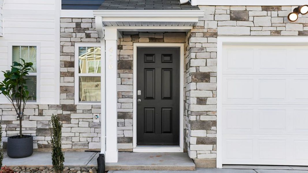Exterior details and patio area of a home in Chestnut Ridge Townhomes, Greenville (Image 2). Exterior details and patio area of a home in Chestnut Ridge Townhomes, Greenville (Image 2).