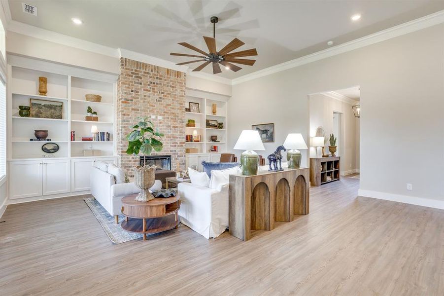 Custom built-in cabinets with decorative ceiling fan