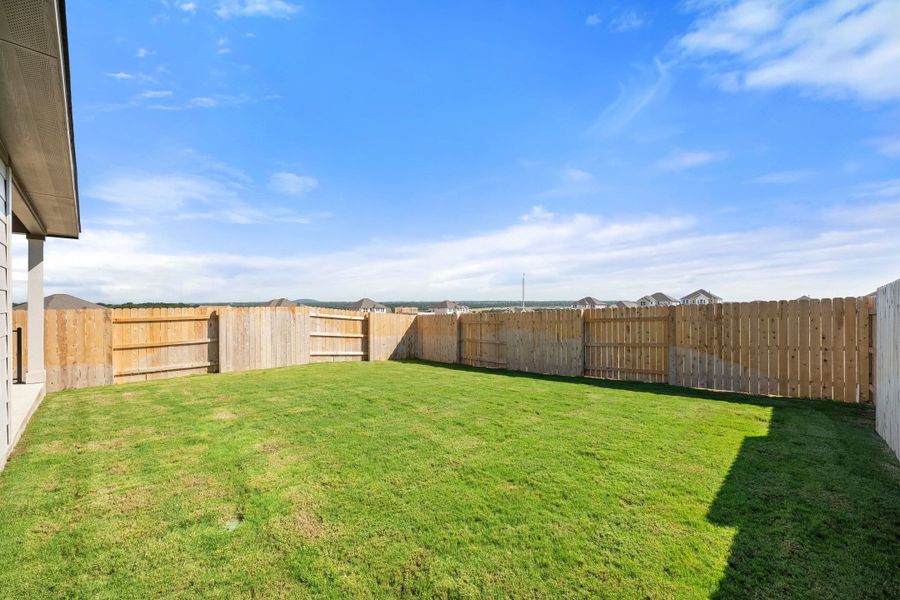 Exterior details and patio area of a home in Lariat, Liberty Hill (Image 30).