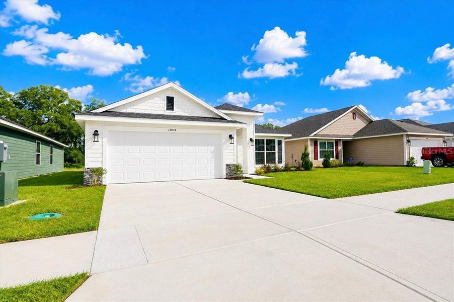 Front exterior of a new home in Country Way South, Newberry, FL, highlighting curb appeal (Image 28).