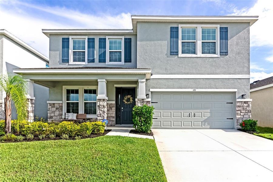 Front exterior of a new home in , Apollo Beach, FL, highlighting curb appeal (Image 37).
