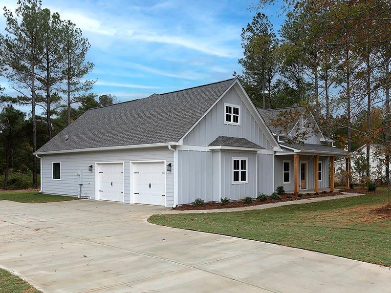 Front exterior of a new home in , Dallas, GA, highlighting curb appeal (Image 1).