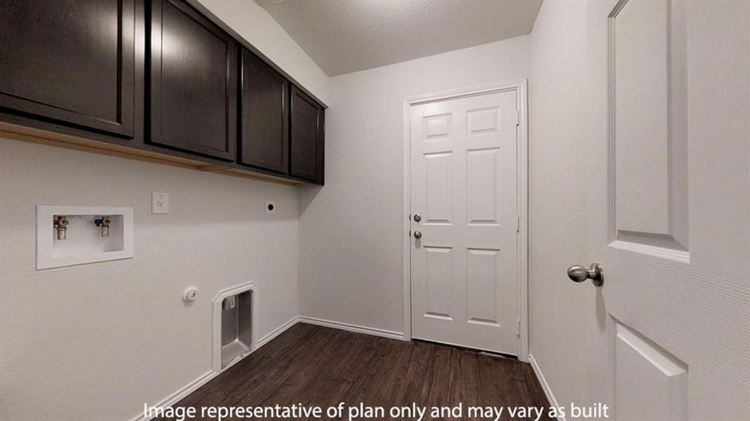 Laundry area featuring gas dryer hookup, dark wood-style flooring, washer hookup, cabinet space, and electric dryer hookup Laundry area featuring gas dryer hookup, dark wood-style flooring, washer hookup, cabinet space, and electric dryer hookup