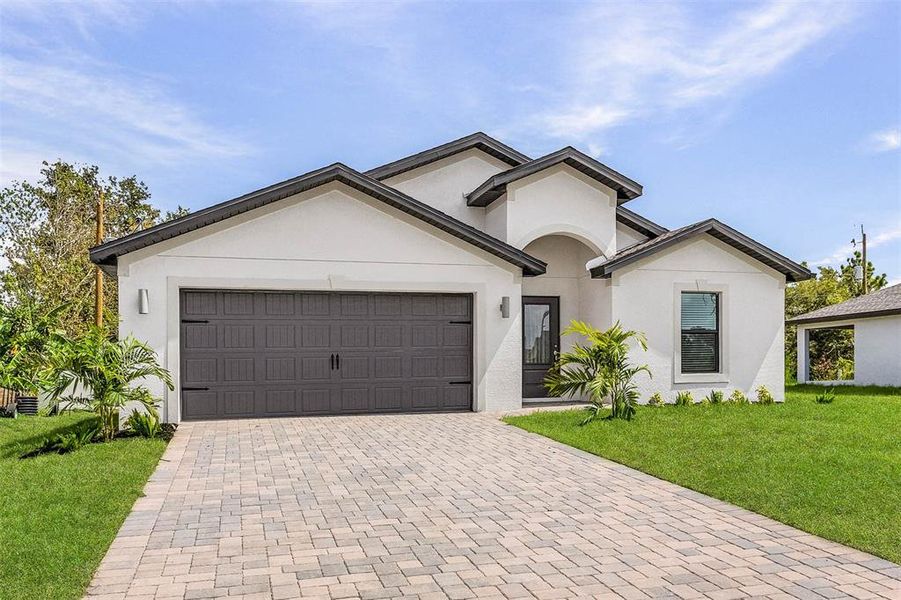 Front exterior of a new home in , Port Charlotte, FL, highlighting curb appeal (Image 2).