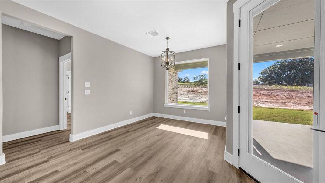 Dining Room with beautiful picture window & upgraded lighting